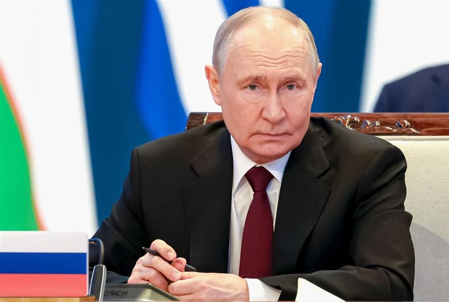(Alexander Kazakov/Sputnik, Kremlin Pool Photo via AP)