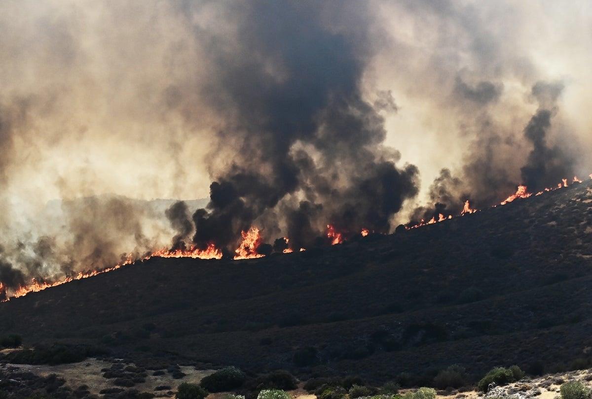 a large fire on a hill