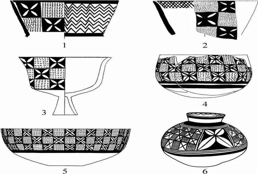 Μικρά τετραπέταλα άνθη τοποθετούνται στο εσωτερικό των μαύρων τετραγώνων ενός σχεδίου που θυμίζει σκακιέρα (Φωτογραφία: Γιοσέφ Γκαρφίνκελ)