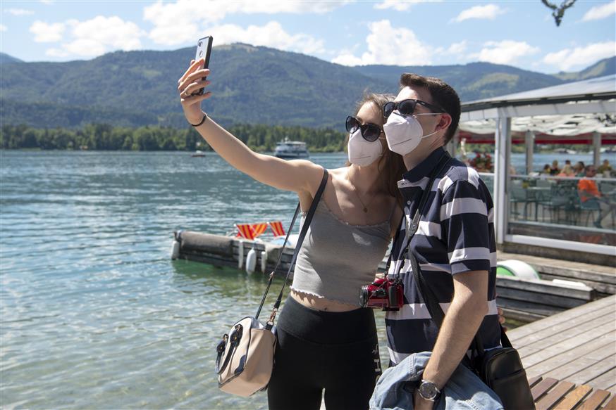 Η επιστροφή των Αυστριακών από τουριστικά hotspots όπως η Ισπανία και η Κροατία έχει εκτοξεύσει τον αριθμό κρουσμάτων AP IMAGES