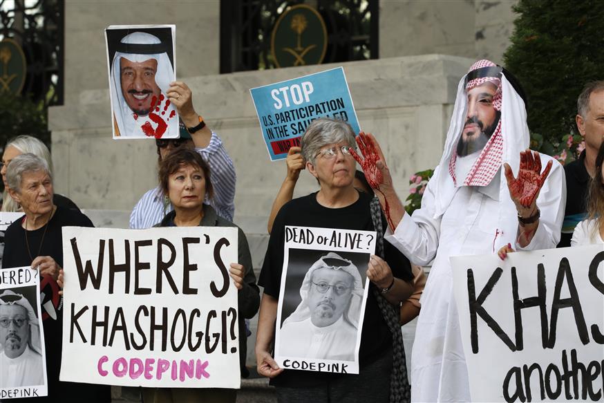 People hold signs at the Embassy of Saudi Arabia during protest about the disappearance of Saudi journalist Jamal Khashoggi, AP/Jacquelyn Martin