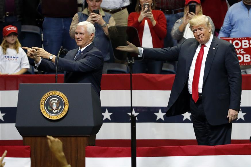 President Donald Trump and Vice President Mike Pence share the stage at a rally Sunday, Nov. 4, 2018, in Chattanooga, Tenn. (AP Photo/Mark Humphrey)