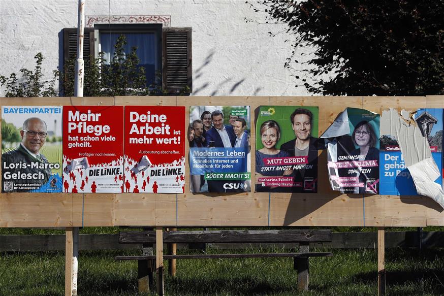 Election Poster stand ((AP Photo/Matthias Schrader)